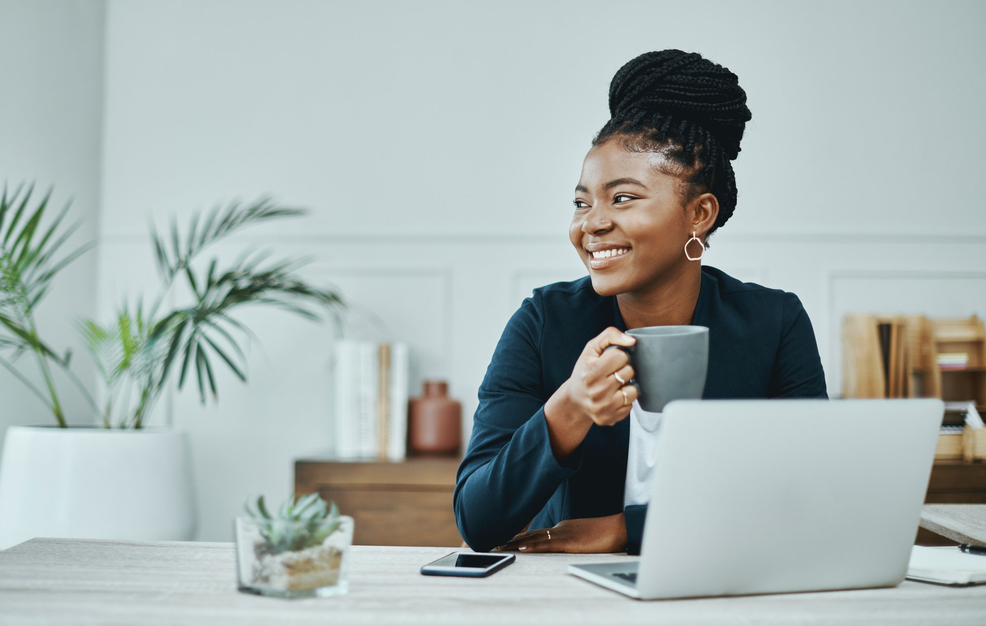 Header_Image-picture-young-black-business-woman-with-coffee-and-laptop-20230504-GLO-EN