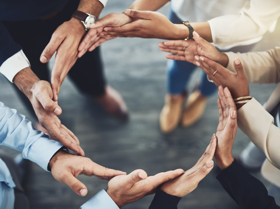 Text-Media_Image picture business people holding hands in a circle 20200520 GLO EN
