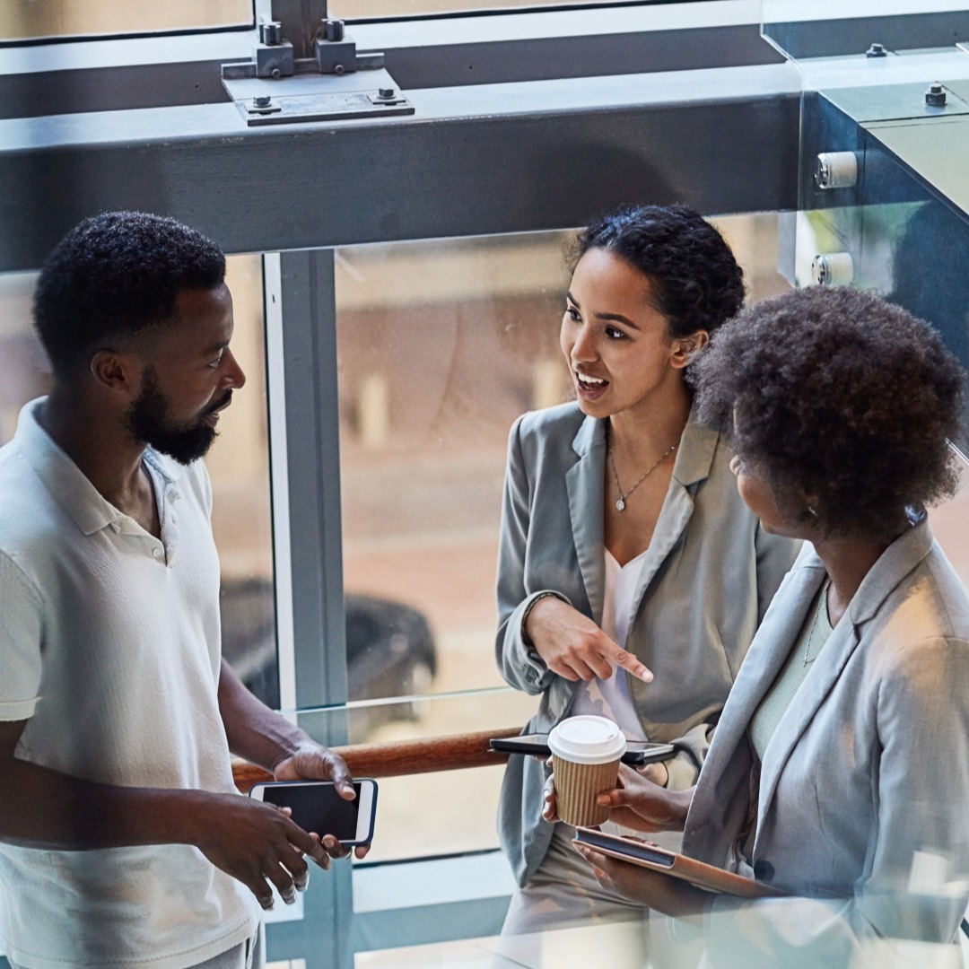 People diversity colleagues standing and talking in office building workplace 20241001 GLO EN